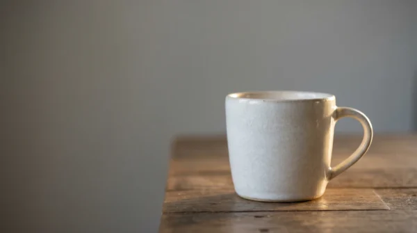 Minimal White Coffee Mug on Table Image