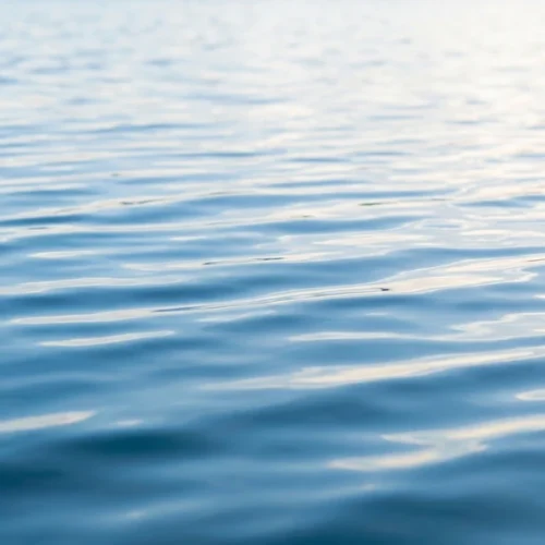 Blue Water Surface Reflection Background